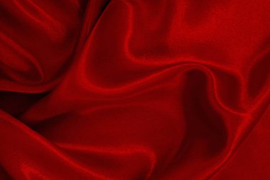 Koyu kırmızı kumaş dokusu arka plan, ipeğin veya keten deseninin ayrıntıları.