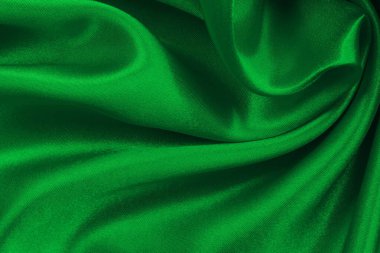 Yeşil zümrüt kumaş dokusu arkaplan, ipeğin veya keten deseninin ayrıntıları.