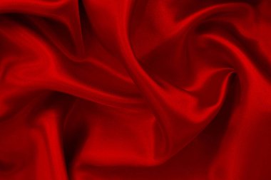 Koyu kırmızı kumaş dokusu arka plan, ipeğin veya keten deseninin ayrıntıları.