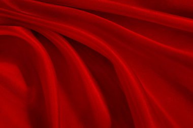 Koyu kırmızı kumaş dokusu arka plan, ipeğin veya keten deseninin ayrıntıları.