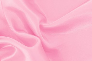 Yumuşak pembe kumaş dokusu arkaplanı, ipeğin veya keten deseninin ayrıntıları.