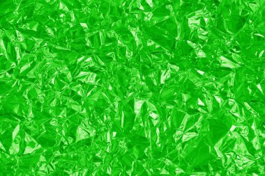 Parlak yeşil kireç folyo dokusu, buruşuk ve dalgalı ambalaj kağıdı deseni.