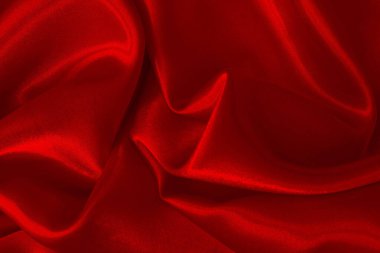 Koyu kırmızı kumaş dokusu arka plan, ipeğin veya keten deseninin ayrıntıları.