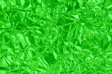 Parlak yeşil kireç folyo dokusu, buruşuk ve dalgalı ambalaj kağıdı deseni.