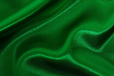 Yeşil zümrüt kumaş dokusu arkaplan, ipeğin veya keten deseninin ayrıntıları.