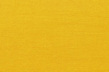 Arka plan için sarı altın sarısı pamuk kumaş kumaş dokusu, doğal tekstil deseni.