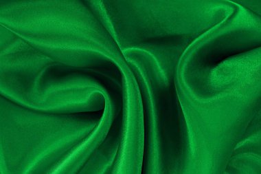 Yeşil zümrüt kumaş dokusu arkaplan, ipeğin veya keten deseninin ayrıntıları.