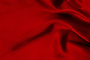 Koyu kırmızı kumaş dokusu arka plan, ipeğin veya keten deseninin ayrıntıları.