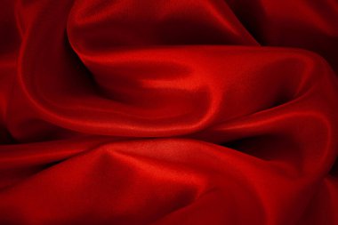 Koyu kırmızı kumaş dokusu arka plan, ipeğin veya keten deseninin ayrıntıları.