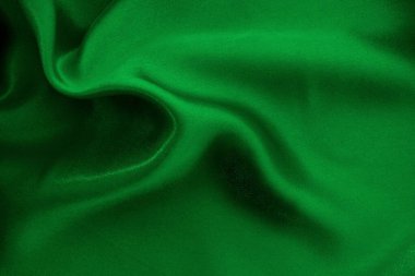 Yeşil zümrüt kumaş dokusu arkaplan, ipeğin veya keten deseninin ayrıntıları.