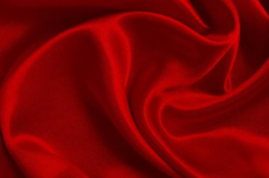 Koyu kırmızı kumaş dokusu arka plan, ipeğin veya keten deseninin ayrıntıları.