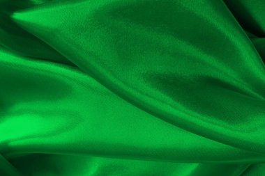 Yeşil zümrüt kumaş dokusu arkaplan, ipeğin veya keten deseninin ayrıntıları.