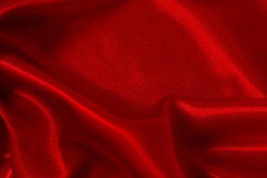 Koyu kırmızı kumaş dokusu arka plan, ipeğin veya keten deseninin ayrıntıları.