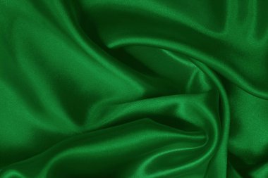 Yeşil zümrüt kumaş dokusu arkaplan, ipeğin veya keten deseninin ayrıntıları.