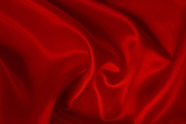 Koyu kırmızı kumaş dokusu arka plan, ipeğin veya keten deseninin ayrıntıları.