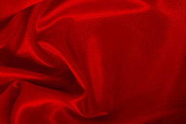 Koyu kırmızı kumaş dokusu arka plan, ipeğin veya keten deseninin ayrıntıları.