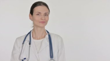 Young Female Doctor Pointing on Side on White Background 