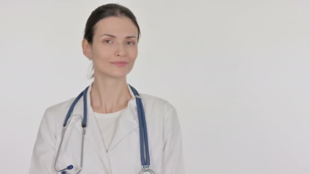 Young Female Doctor Pointing Side White Background — Stockvideo