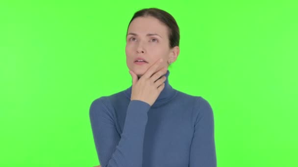 Pensive Young Woman Thinking New Idea Green Background — Stock Video
