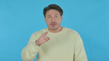 Disappointed Handsome Young Man Reacting Loss on Blue Background