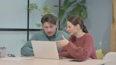 Creative Business People Working on Laptop in Office