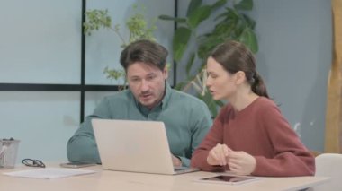 Creative Business People Discussing Work in Office