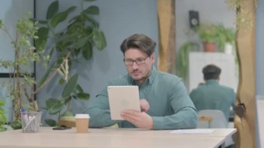 Middle Aged Businessman using Digital Tablet, Browsing Internet