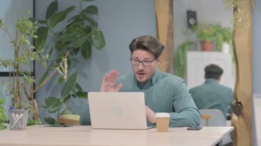 Online Video Chat on Tablet by Middle Aged Businessman