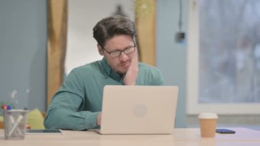 Portrait of Mature Adult Businessman having Toothache in Office
