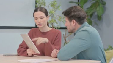 Creative Business People Working on Tablet  in Office