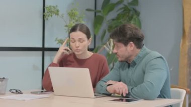 Angry Woman Fighting with Man in Office