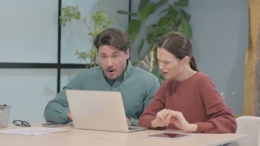 Creative Business People Reacting to Loss at Work