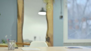 Mature Adult Businessman Coming Back to Office and Opening Laptop