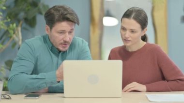 Creative Young People Working on Laptop in Office