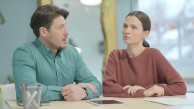 Close Up of Creative Young People Talking in Office