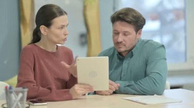 Creative Young People Working on Tablet  in Office