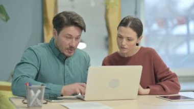 Creative Young People Celebrating Success at Work