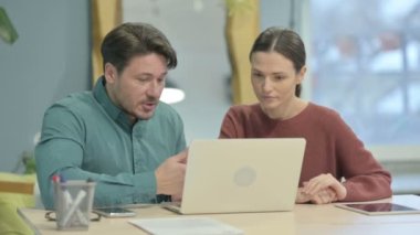 Angry Creative Young People Discussing Problem in Office