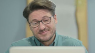 Close Up of Businessman Doing Video Chat on Laptop