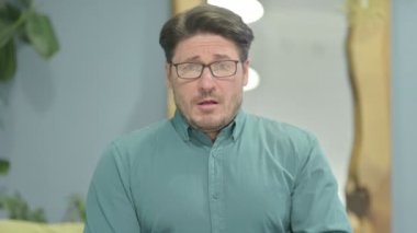 Portrait of Middle Aged Businessman suffering with Cough