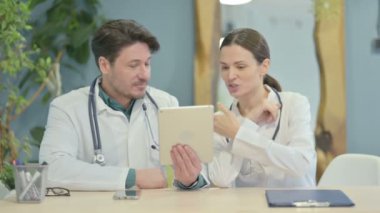 Male and Female Doctor Doing Online Video Chat