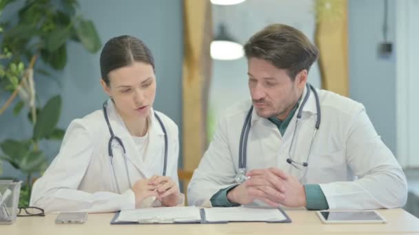 Male Female Doctor Discussing Patient Clinic — Vídeos de Stock