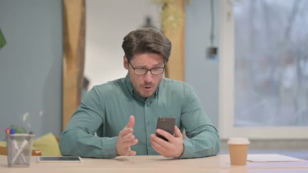 Upset Mature Adult Businessman Reacting Loss Smartphone — Stockvideo