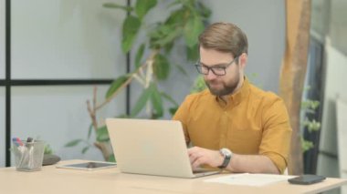 Online Video Chat on Tablet by Middle Aged Businessman