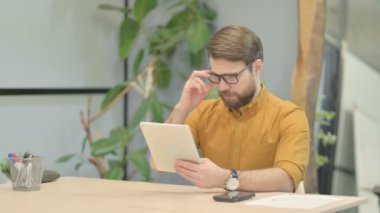 Middle Aged Businessman Cheering Win on Digital Tablet
