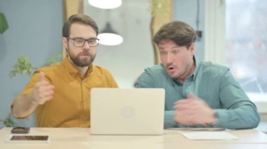 Creative Business People Reacting to Loss at Work