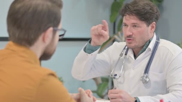 Young Doctor Talking Patient Clinic Treatment — Vídeo de stock