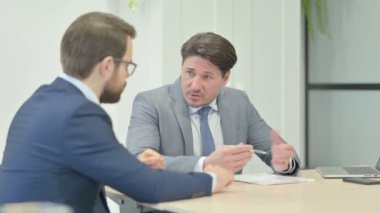 Businessman Talking with Partner at Work