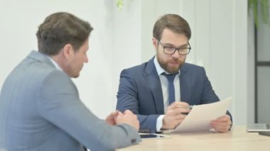 Talking Businessmen During Meeting Shaking Hand, Deal