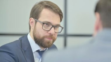 Close Up of Businessman Talking with Partner